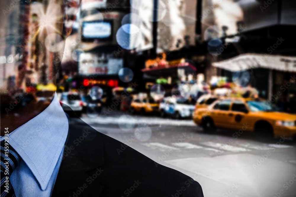 Composite image of businessman standing against white background