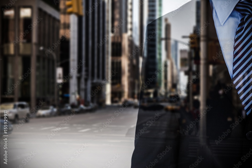 Composite image of mid section of businessman wearing full suit