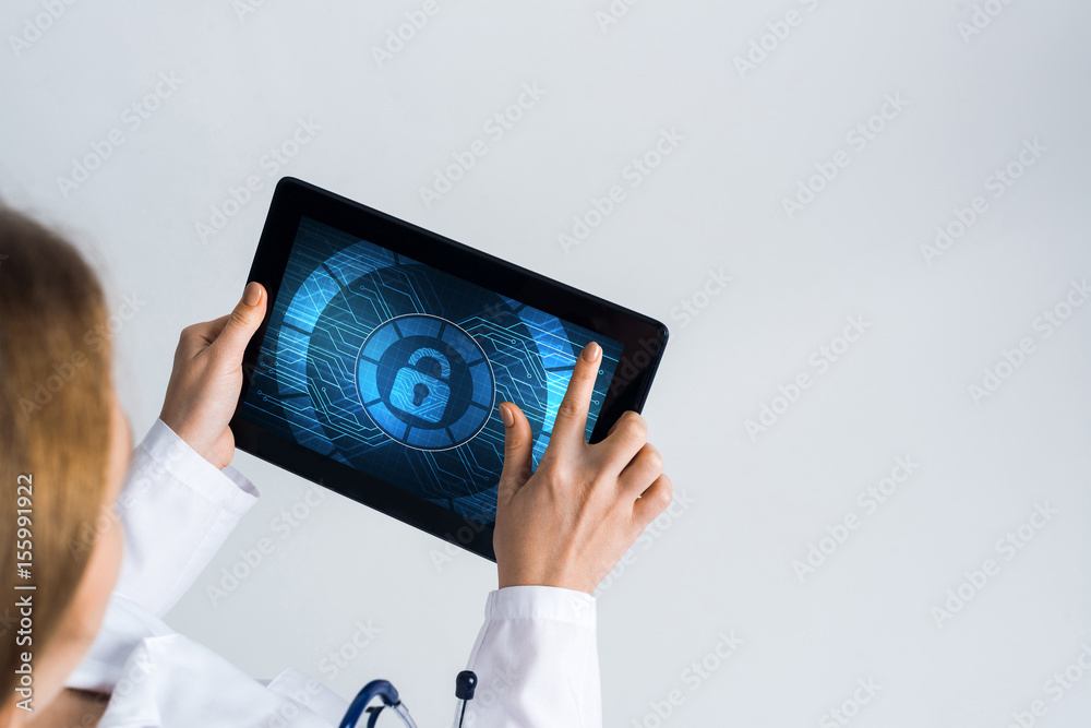 Close of female doctor hands working with tablet pc computer