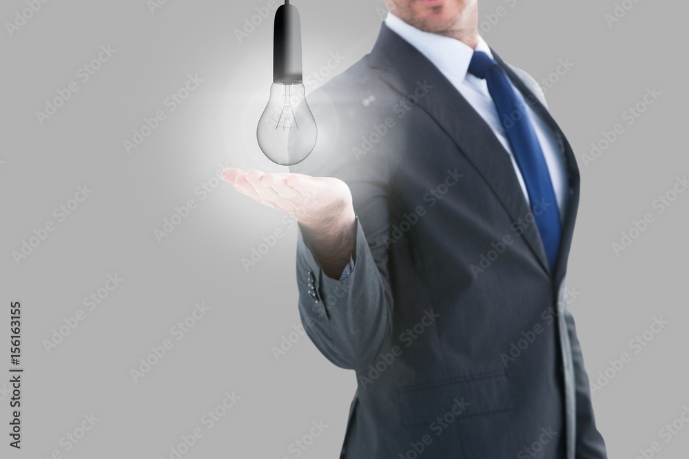 Light bulb in businessman hands