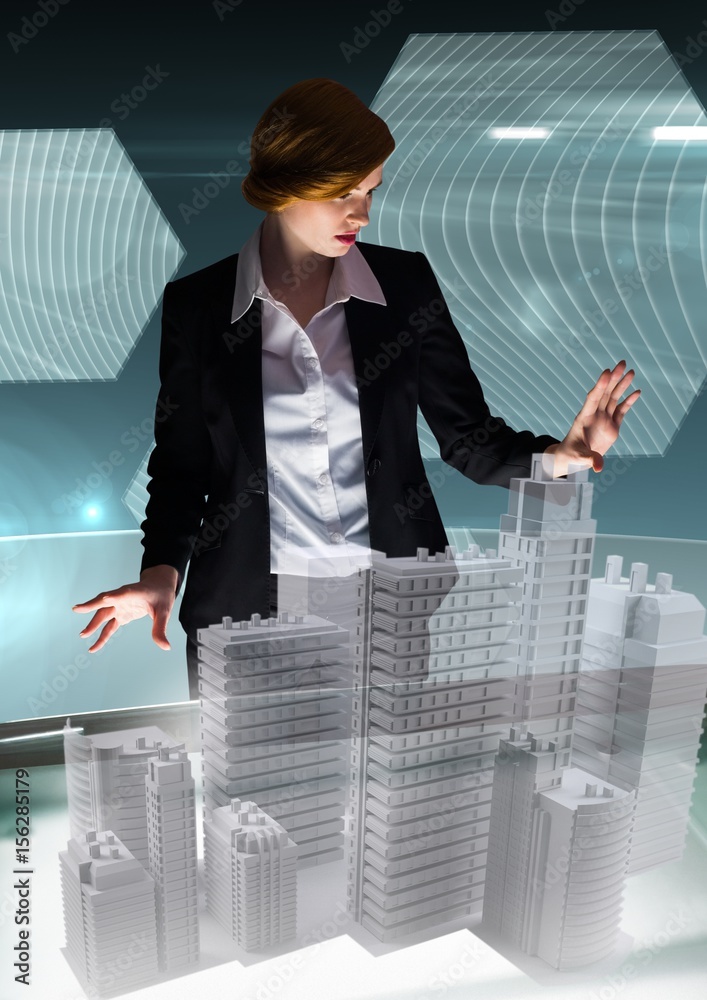 Young businesswoman in a futuristic room interface about city