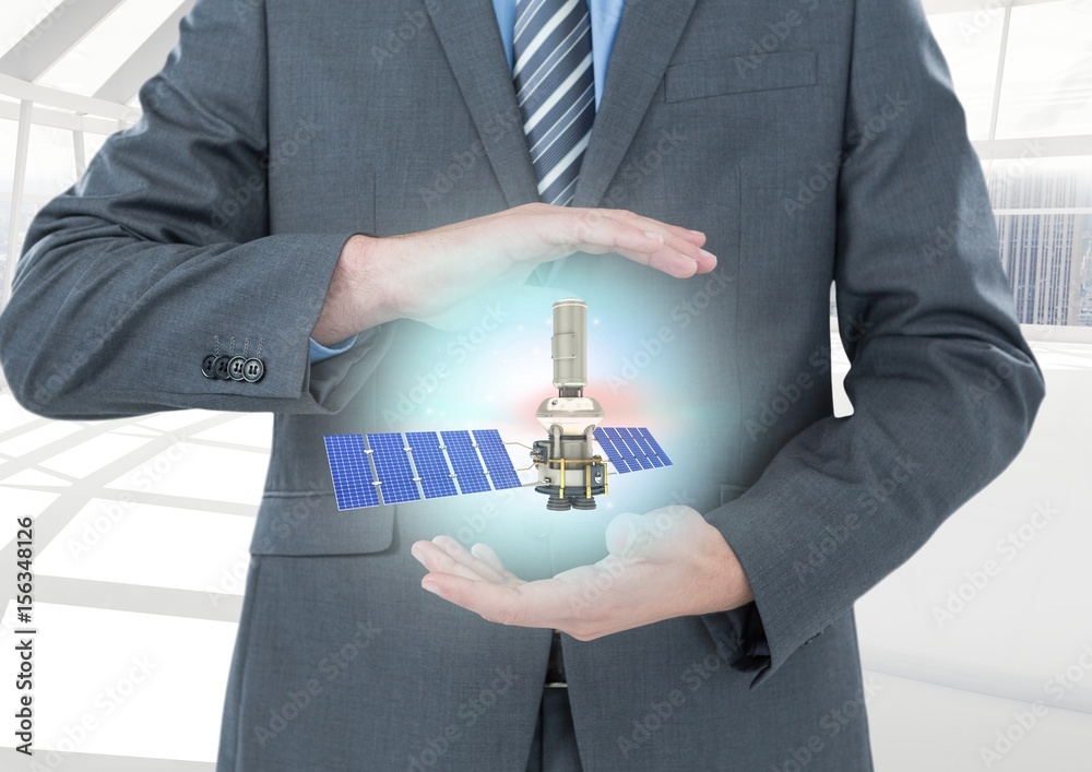 solar panel satellite between businessman  hands with light