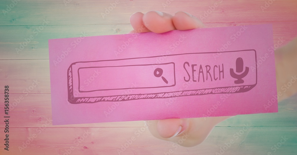 Hand with pink card showing pink search bar against wood panel