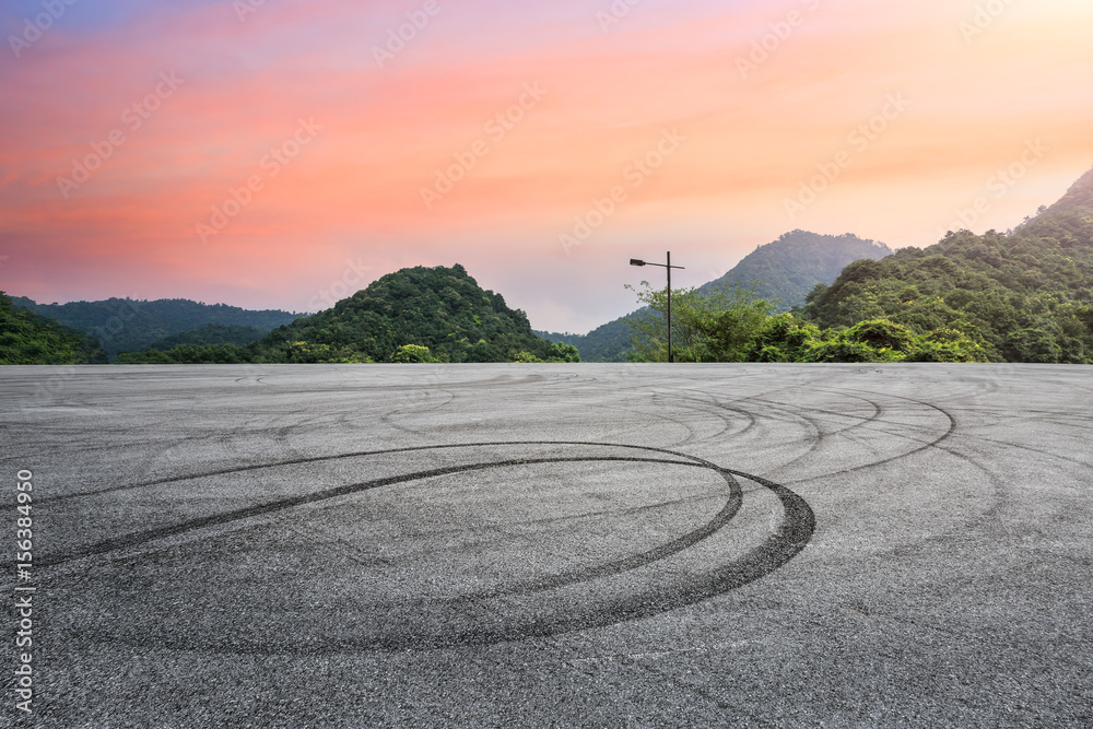 asphalt road in the mountains at sunset