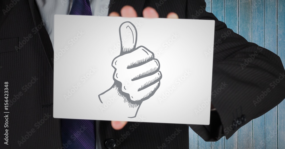 Businessman mid section showing thumbs up 