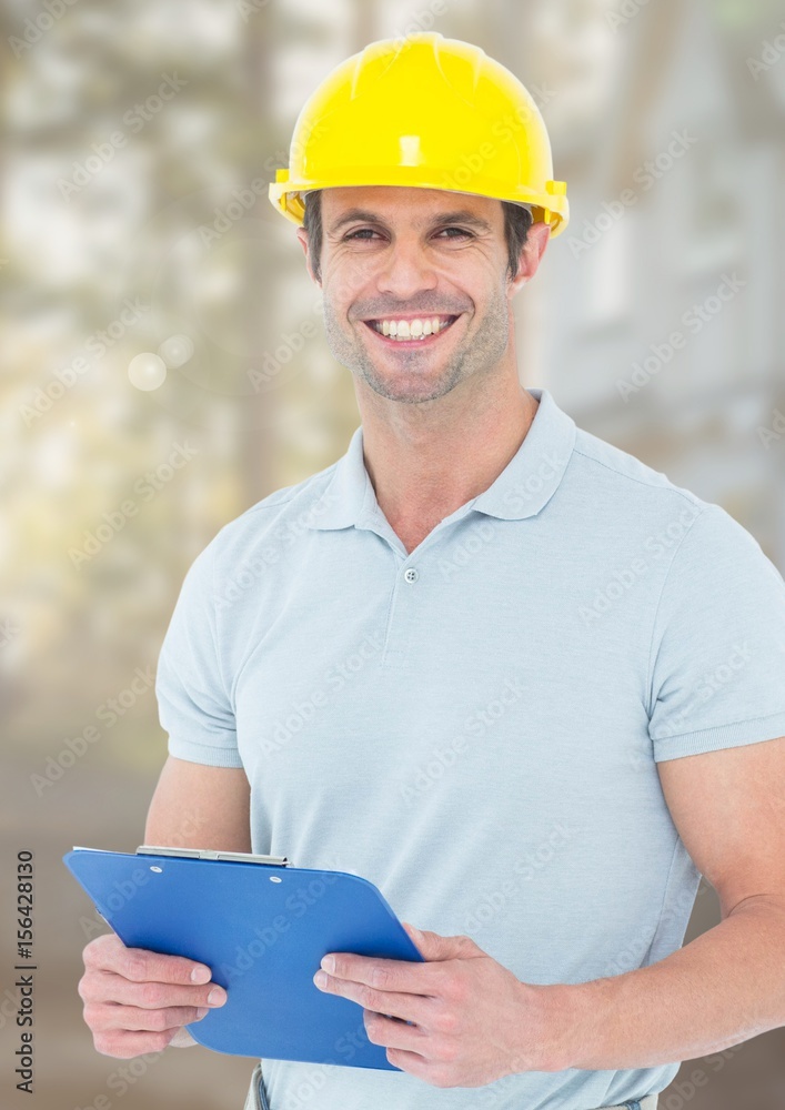 Construction Worker with chart in front of construction site