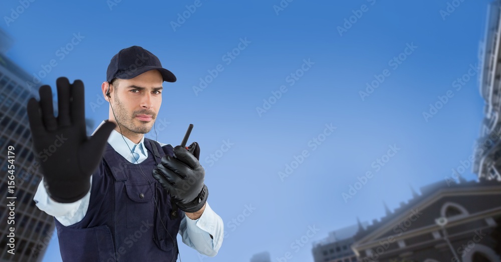 Portrait of security guard showing stop gesture 