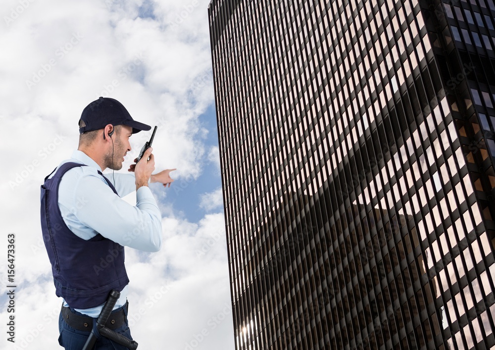 Security guard talking on walkie talkie 