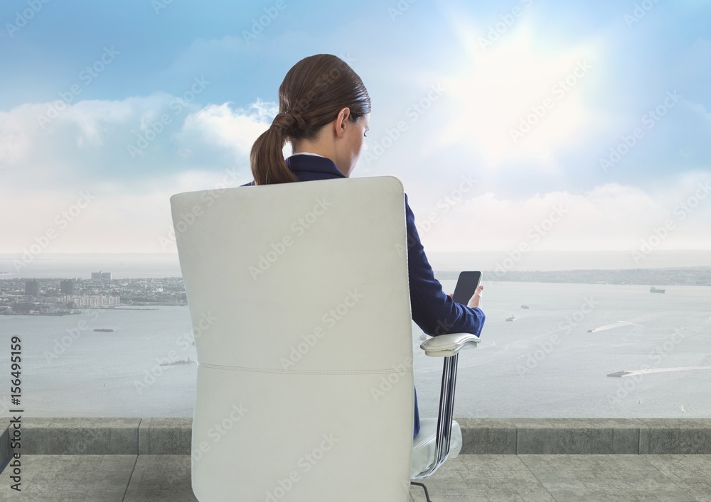 Rear view of businesswoman sitting on chair 