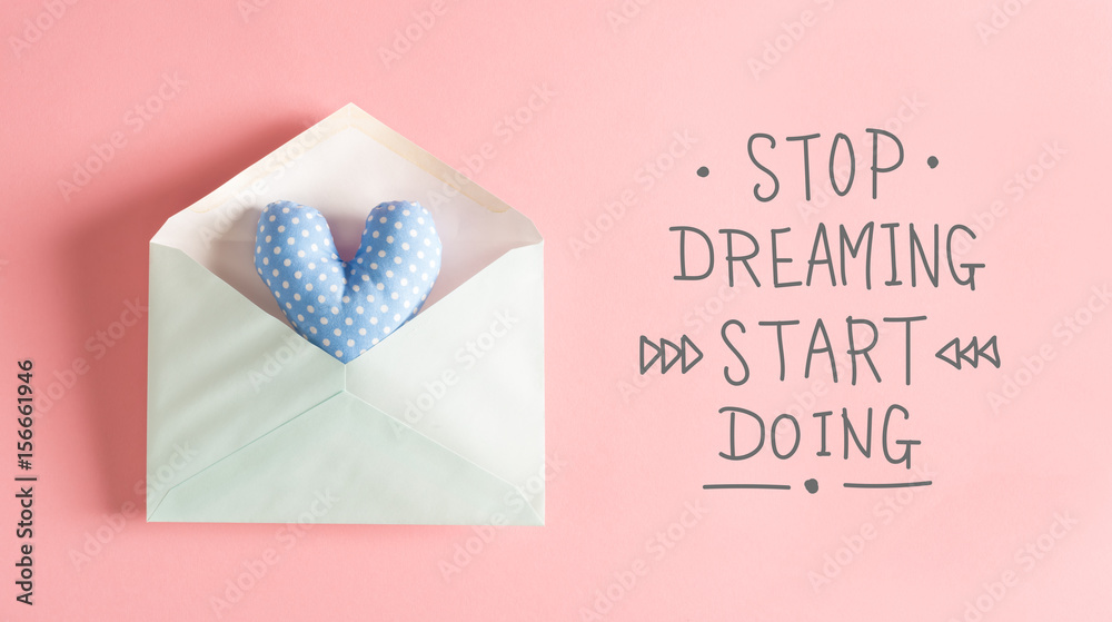 Stop Dreaming Start Doing message with a blue heart cushion