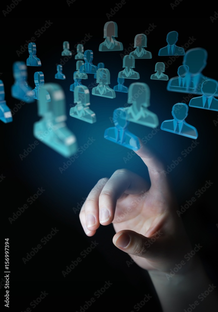 Businessman holding 3D rendering group of blue people