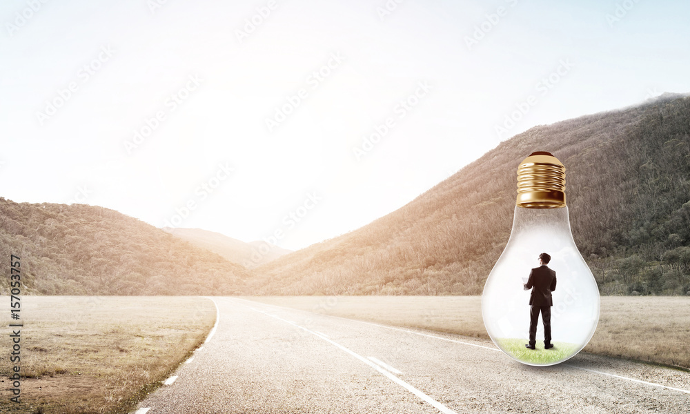 Businessman inside light bulb