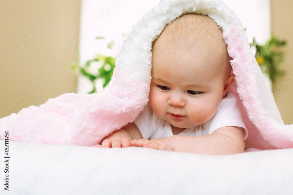 Happy newborn baby girl smiling