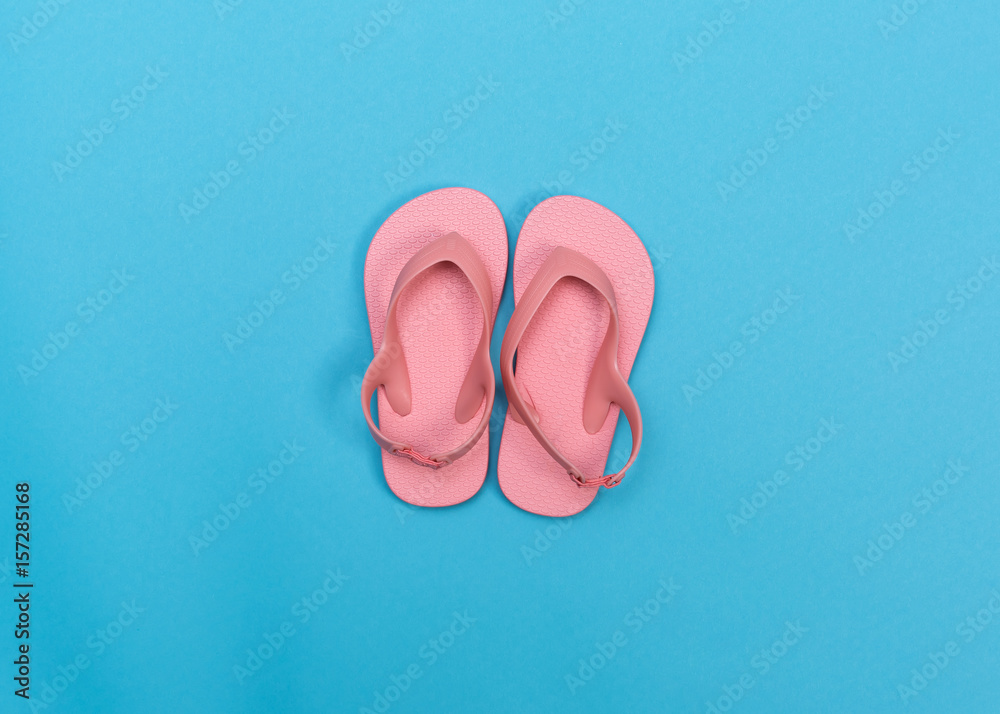 Beach sandals on a blue background