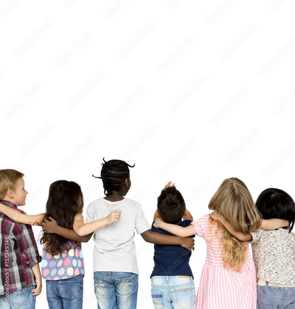 Group of children huddle together in rear view