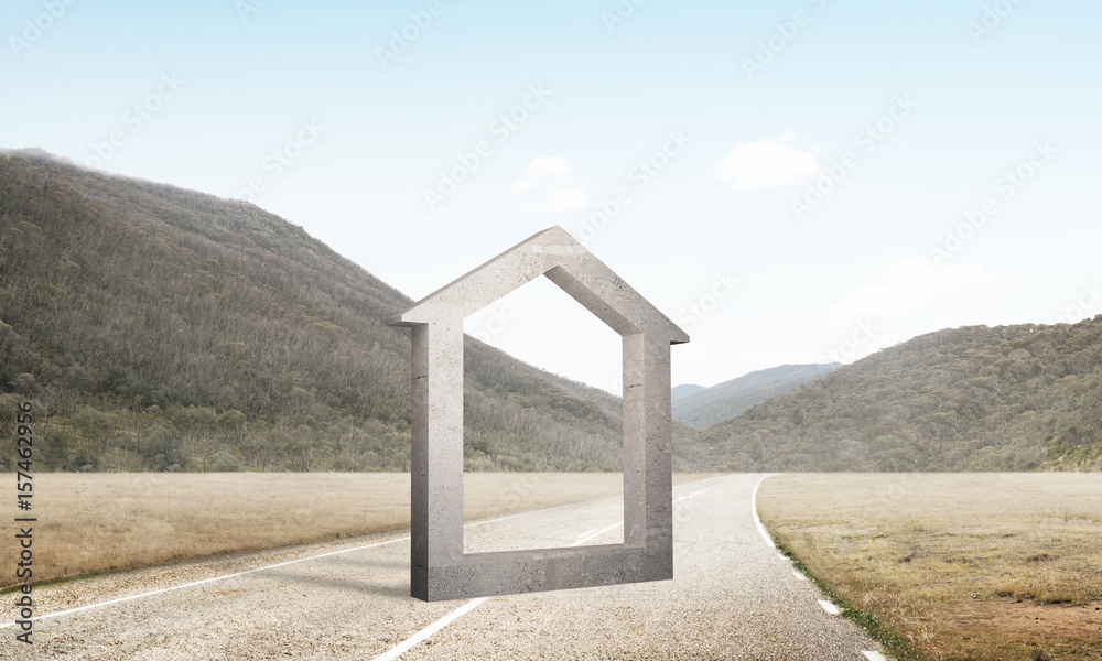 Conceptual background image of concrete home sign on asphalt road