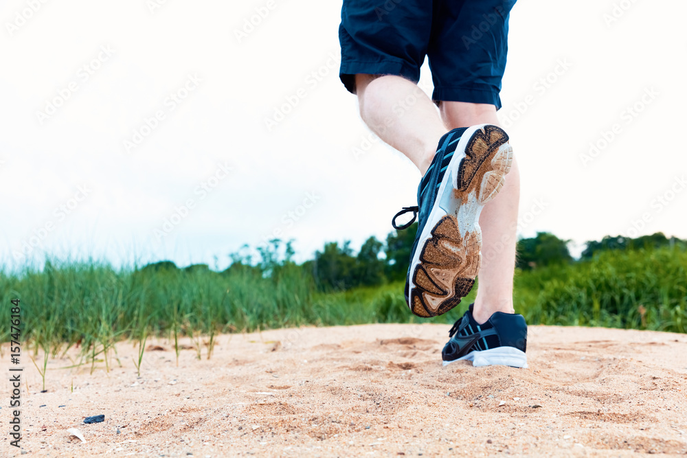 Runner jogging at the sand