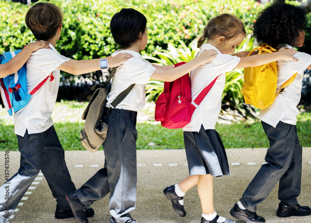 Group of diverse kindergarten students walking together