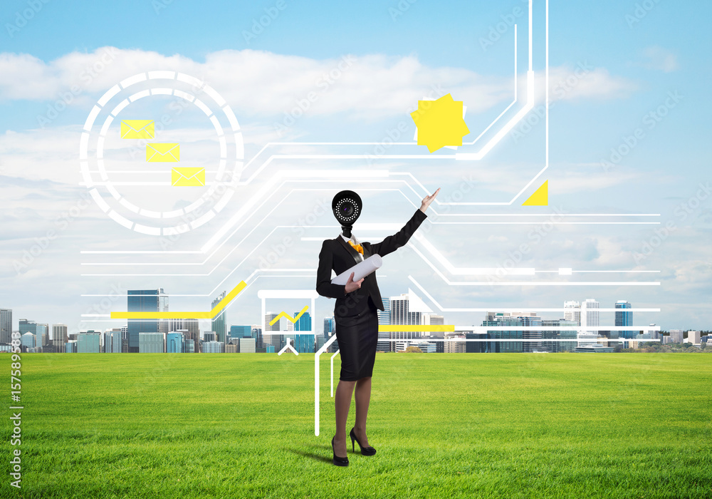 Camera headed woman standing on green grass against modern cityscape