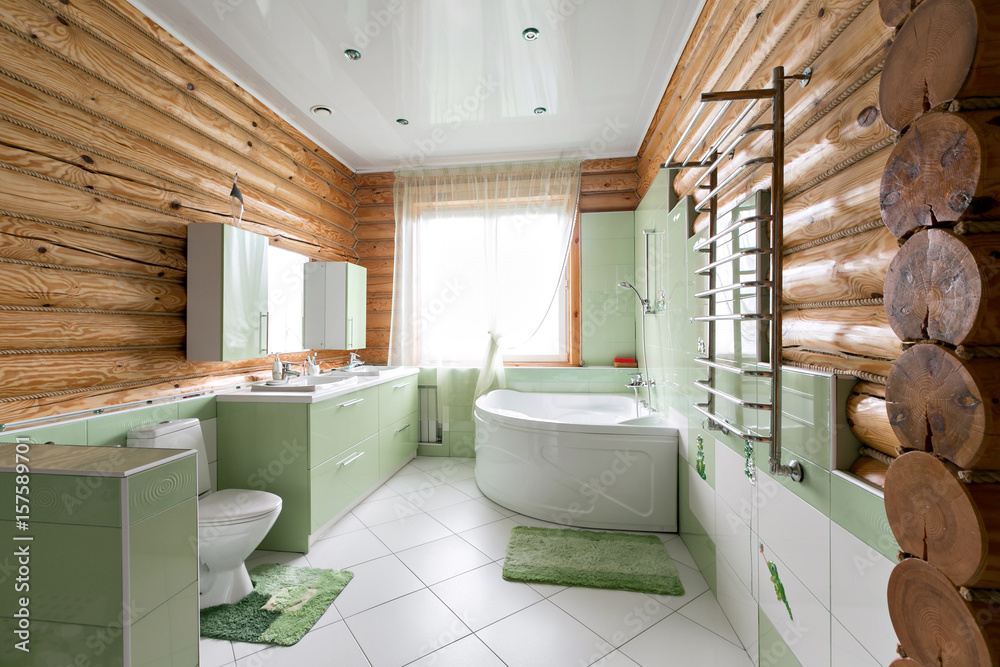 The bathroom in a rustic log cabin, in the mountains. with a beautiful interior. house of pine logs