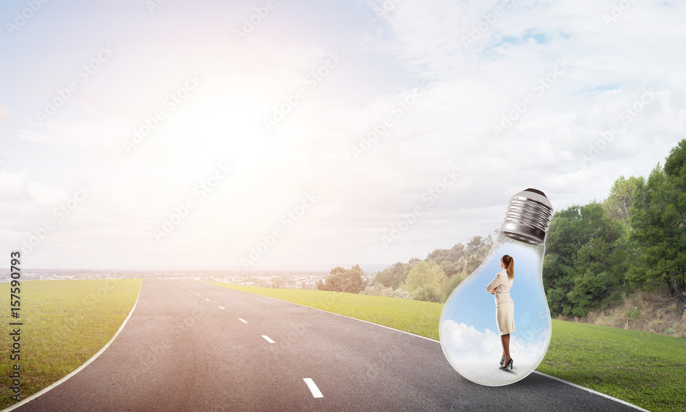 Businesswoman inside light bulb