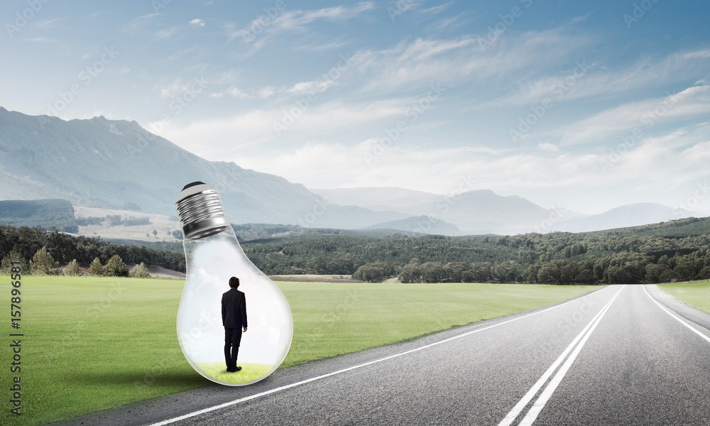 Businessman inside light bulb