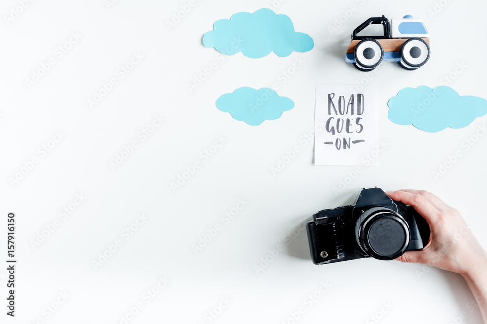 planing trip with child with photo camera white background top view space for text