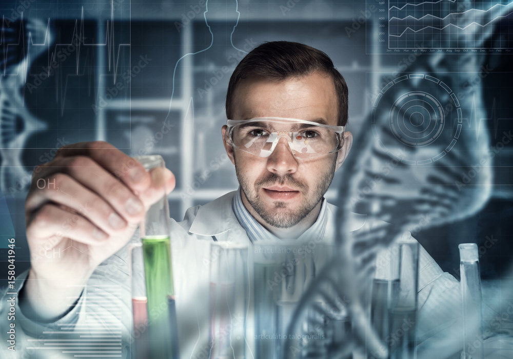 Young scientist mixing reagents in glass flask in clinical laboratory