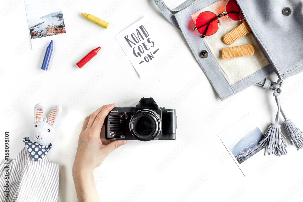 planing trip with child with camera white background top view