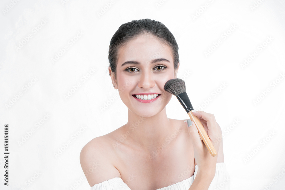 Asian Woman beauty ace Makeup. Portrait Of beautiful Asian young female applying foundation on face 