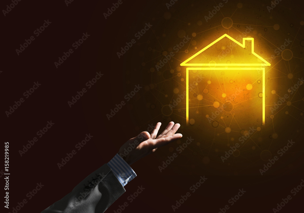 Conceptual image with hand pointing at house or main page icon on dark background