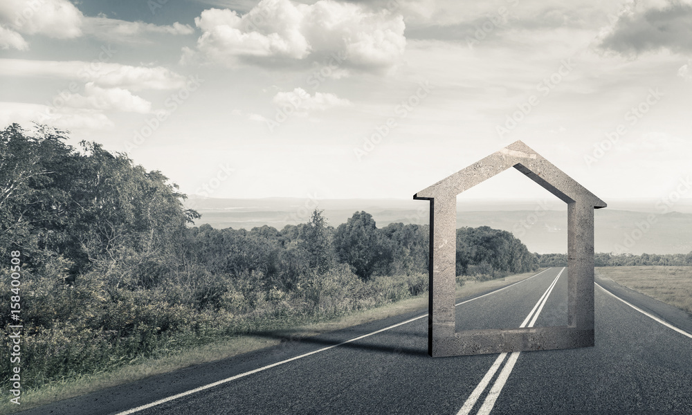 Conceptual background image of concrete home sign on asphalt roa