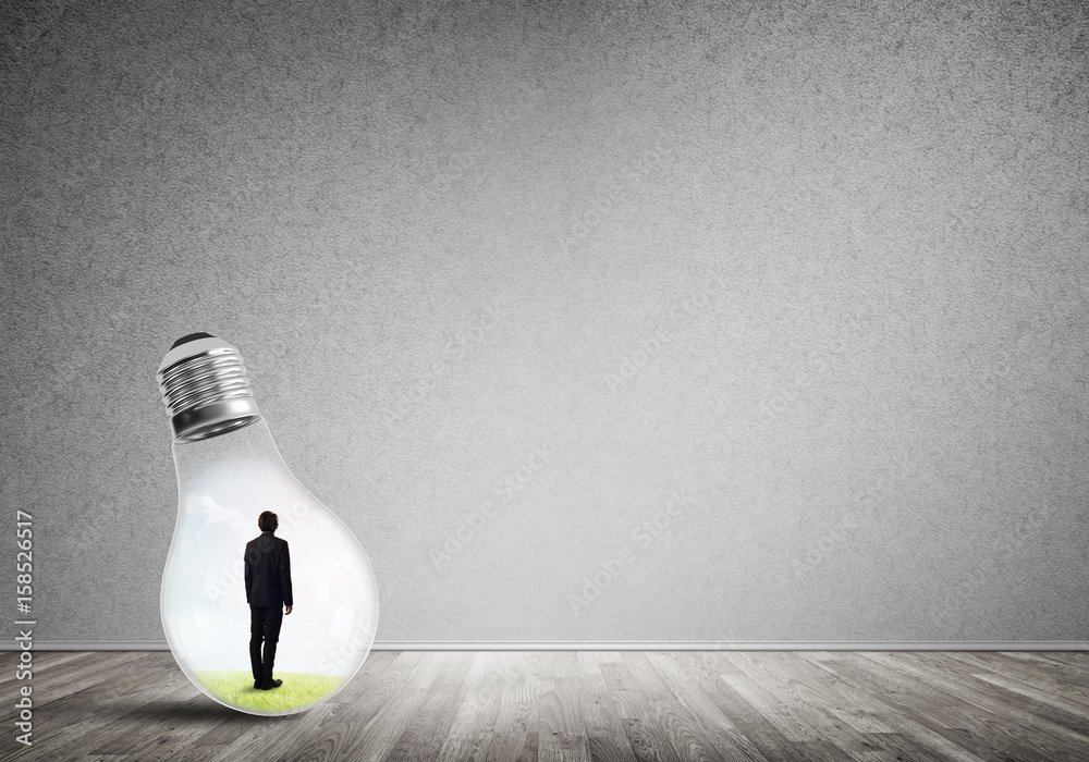 Businessman trapped in bulb