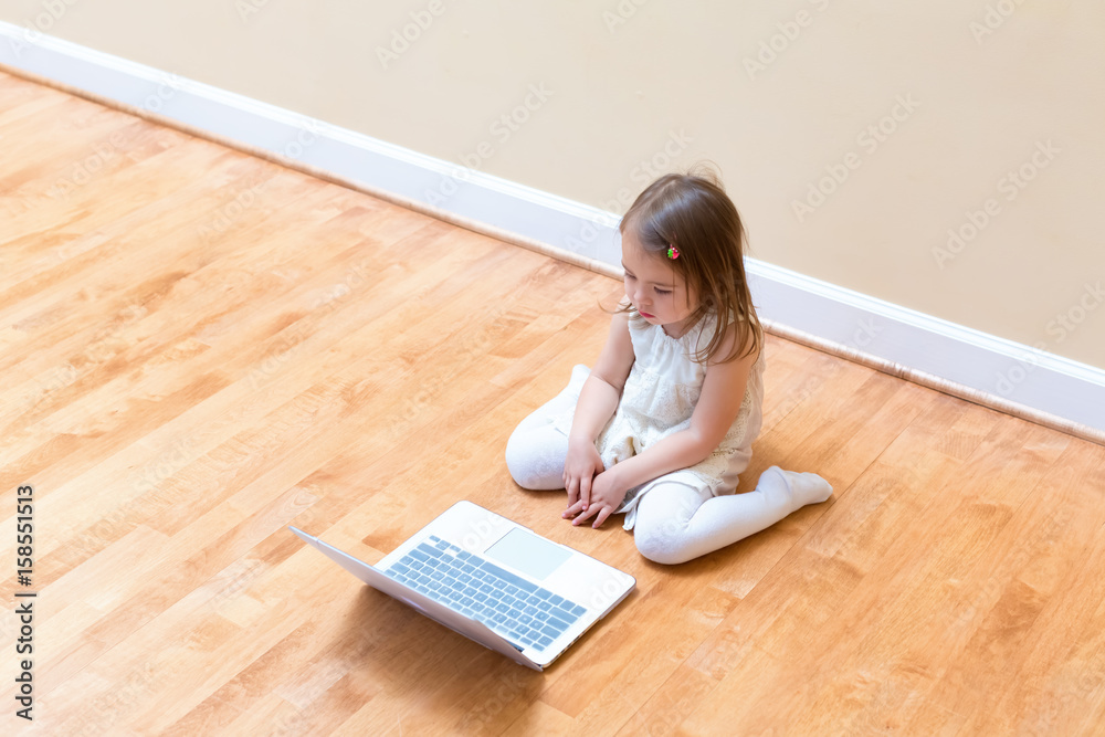 Little girl with her laptop computer