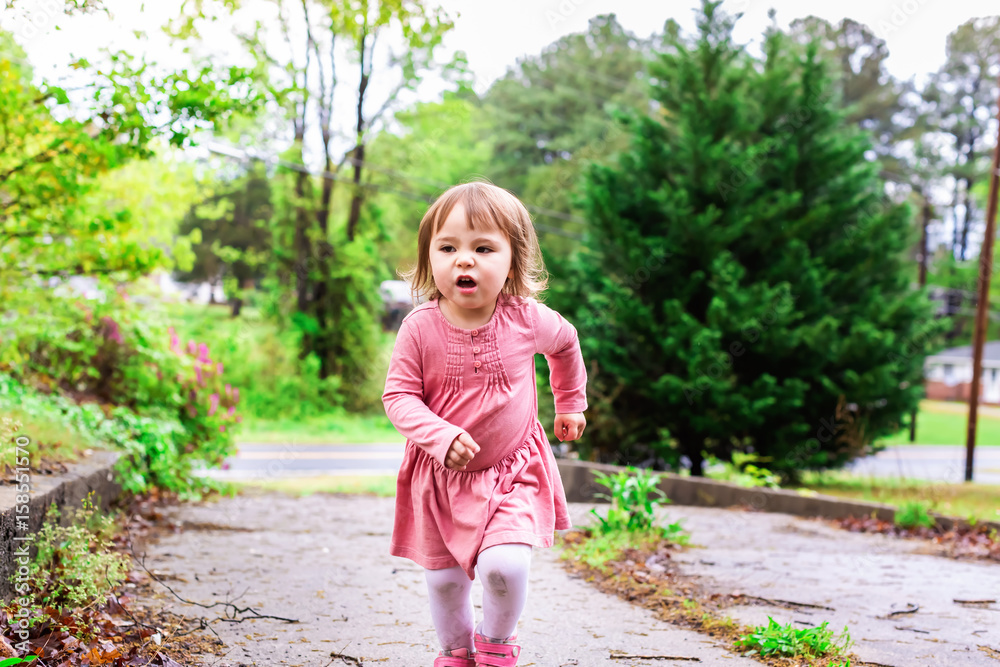 Happy toddler girl playing