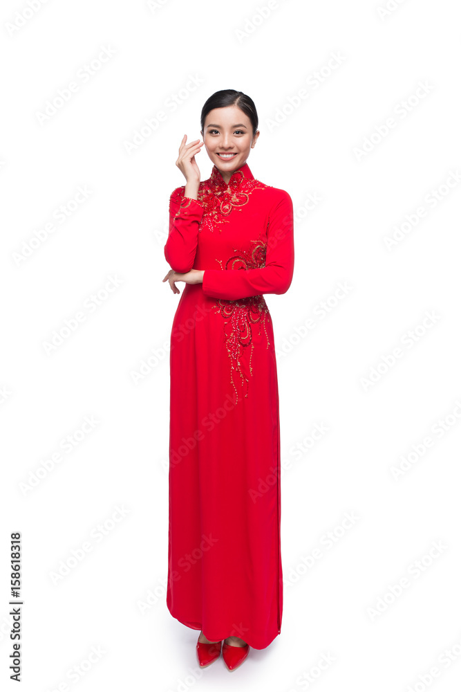 Full body of charming Vietnamese Woman in Ao Dai Traditional Dress isolated on white.