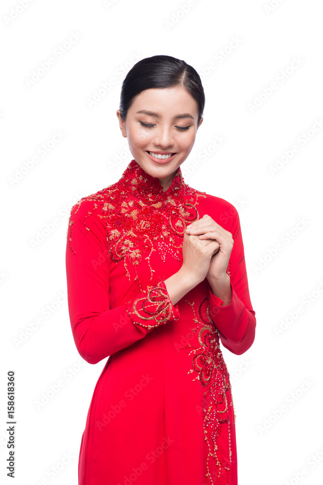 Charming Vietnamese Woman in Ao Dai Traditional Dress, Gesture to Pray or Wishing.