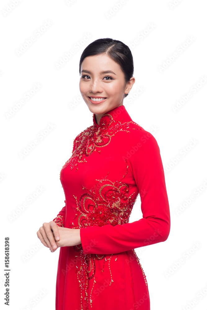 Charming Vietnamese Woman in Ao Dai Traditional Dress isolated on white.