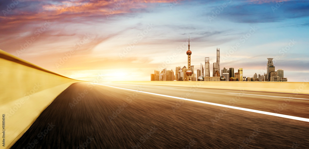 Motorway and modern city skyscrapers