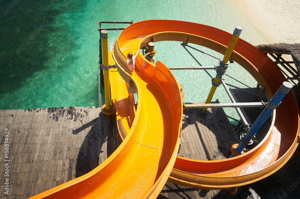 Beautiful tropical beach  with waterslide playground on jetty .Rawa island , Malaysia .