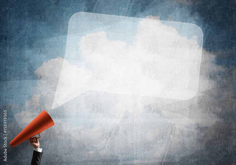 Hand of businesswoman holding red paper trumpet and speech cloud