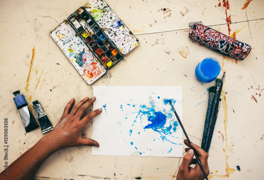 Female artist drawing on paper