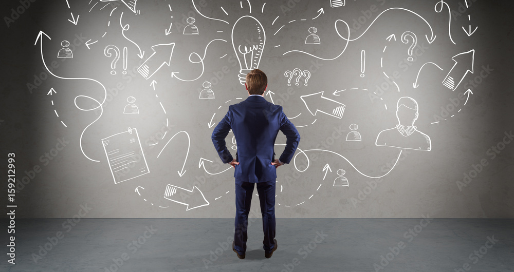 Businessman watching a project sketch on a wall 3D rendering