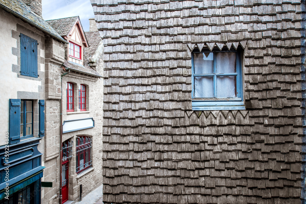 Architechtural fragment of the ancient buildings of the old town on the famous Mont Saint Michel isl