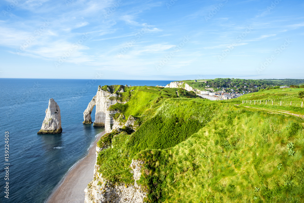 Landscape view on the famous rocky coastline near Etretat town in France during the sunny day