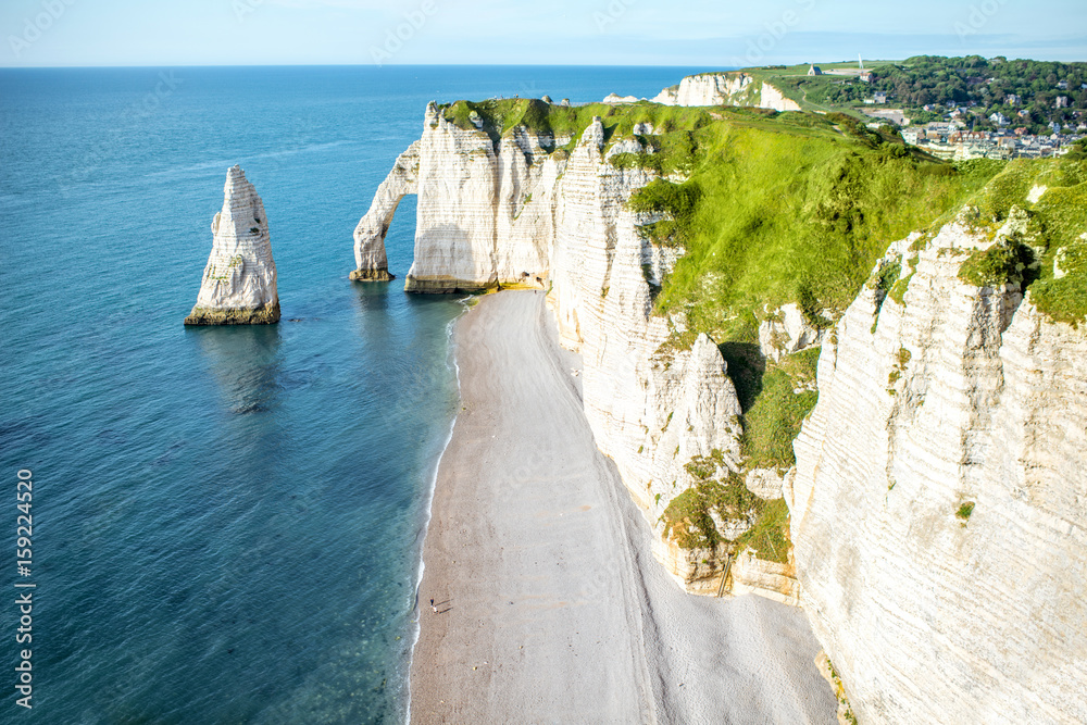 Landscape view on the famous rocky coastline near Etretat town in France during the sunny day