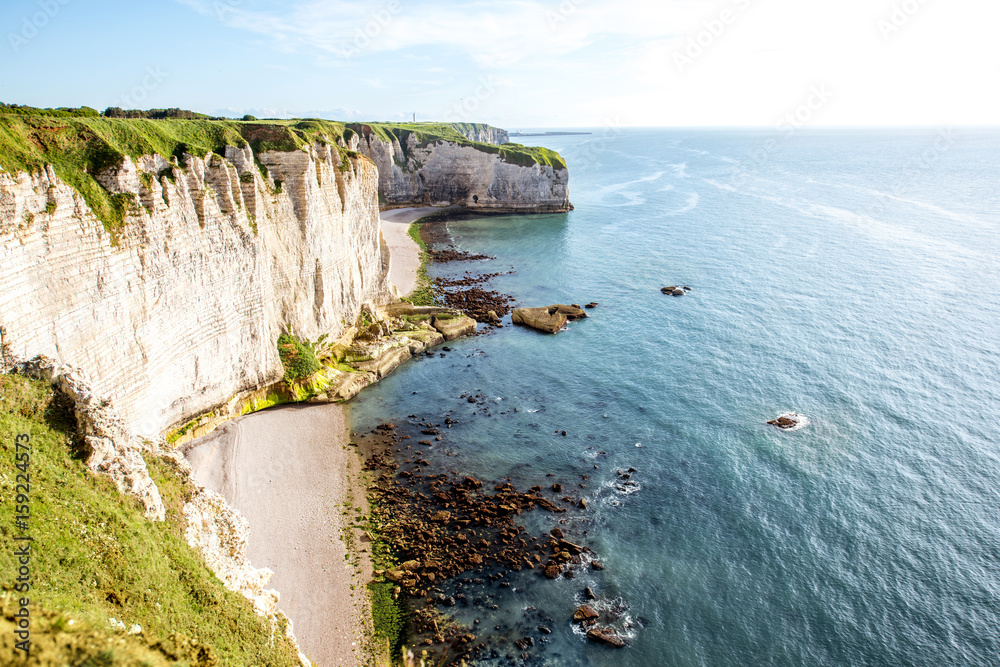 Landscape view on the famous rocky coastline near Etretat town in France during the sunny day