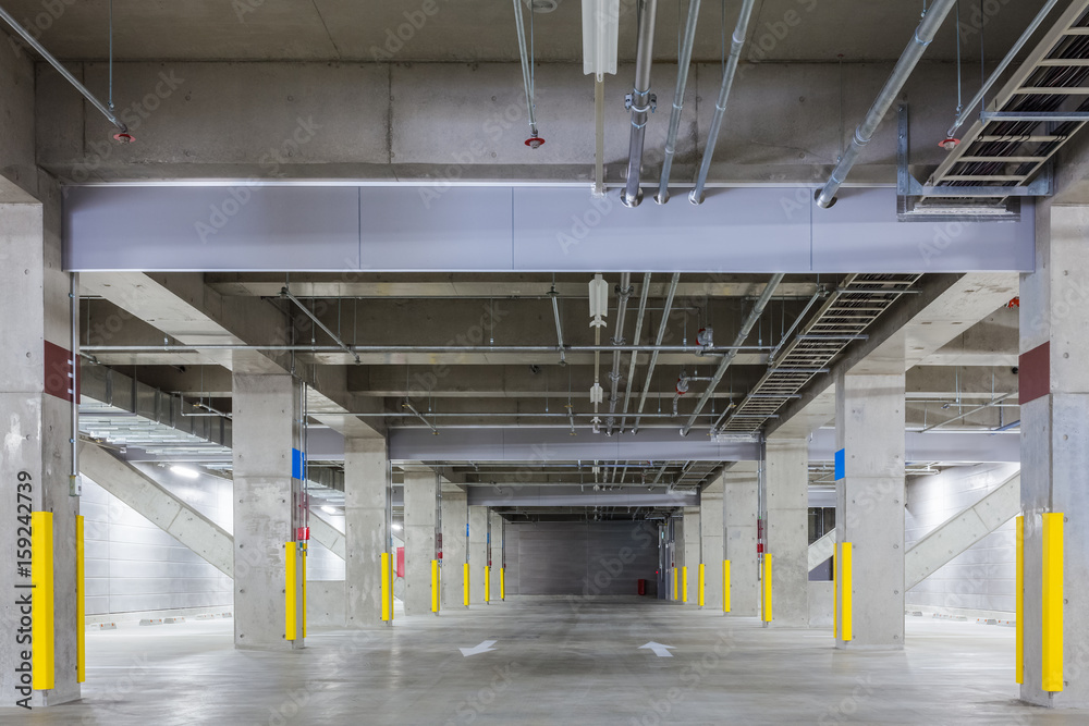 Parking garage underground interior, neon lights at night..