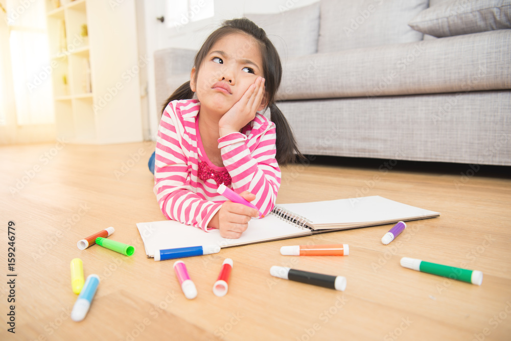 depressed girl drawing with colorful pen