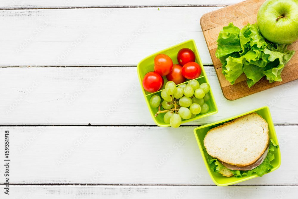 healthy food in lunchbox for dinner at school white table background top view mockup